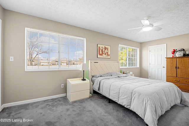 bedroom featuring a ceiling fan, carpet, baseboards, and a textured ceiling