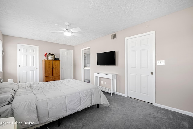 bedroom featuring visible vents, baseboards, ceiling fan, dark carpet, and a textured ceiling