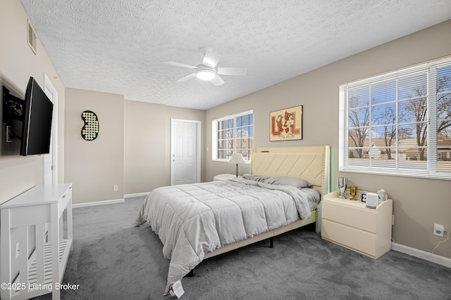 bedroom featuring visible vents, carpet floors, baseboards, and a ceiling fan