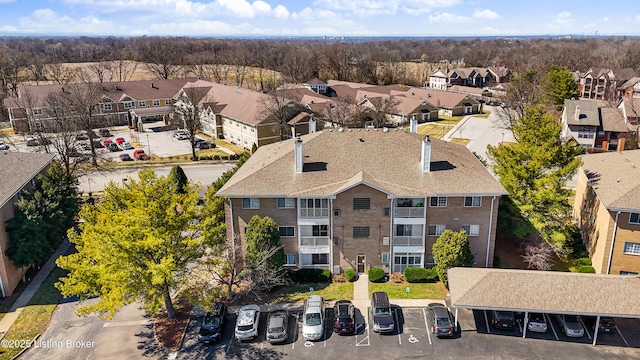 birds eye view of property with a residential view