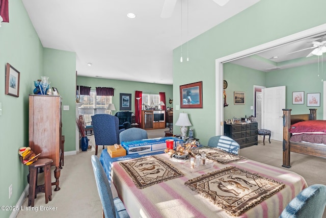 dining space featuring baseboards, ceiling fan, and carpet floors