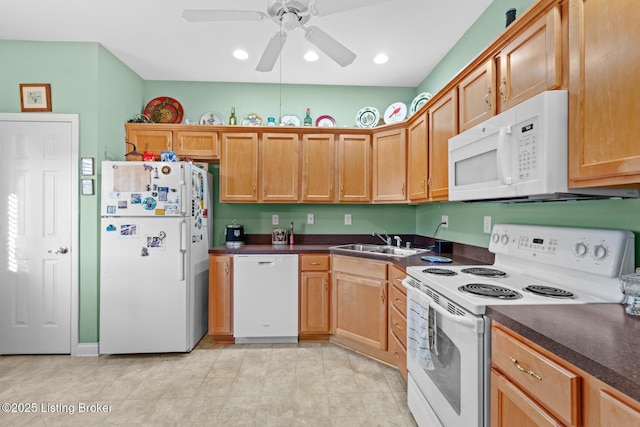 kitchen featuring a ceiling fan, a sink, dark countertops, recessed lighting, and white appliances