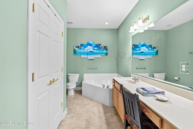 bathroom featuring vanity, a garden tub, toilet, and visible vents