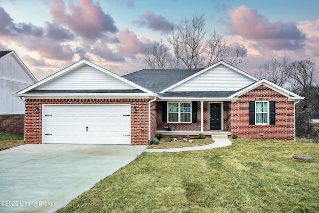 ranch-style home with a front lawn, roof with shingles, concrete driveway, a garage, and brick siding