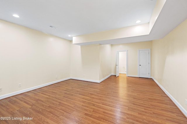 interior space with light wood-style flooring, recessed lighting, visible vents, and baseboards