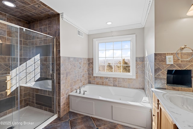 bathroom featuring tile patterned floors, a garden tub, visible vents, and ornamental molding