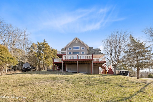 rear view of property with stairway, a lawn, and a wooden deck