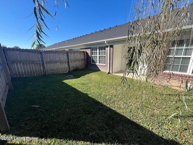 view of yard featuring a fenced backyard