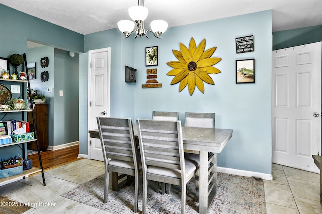 221 Forrest Dr, Lawrenceburg, KY 40342 - dining room featuring a chandelier, baseboards, and light tile patterned floors
