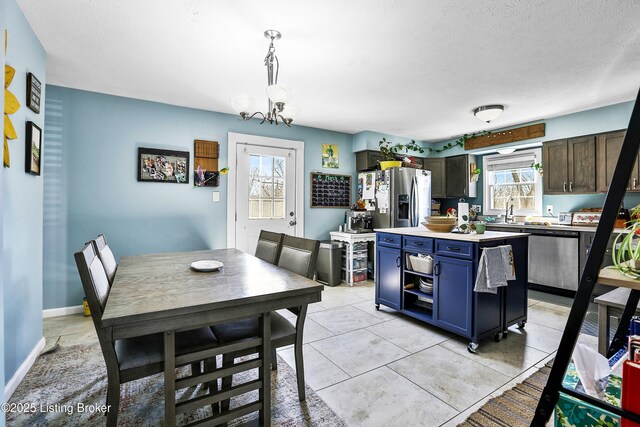 221 Forrest Dr, Lawrenceburg, KY 40342 - dining space featuring a chandelier and a textured ceiling