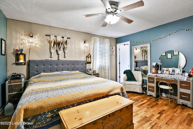 221 Forrest Dr, Lawrenceburg, KY 40342 - bedroom featuring wood finished floors, a ceiling fan, and a textured ceiling