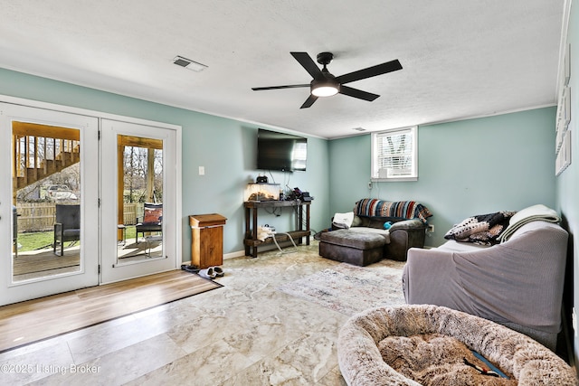 221 Forrest Dr, Lawrenceburg, KY 40342 - living area featuring ceiling fan, plenty of natural light, a textured ceiling, and baseboards