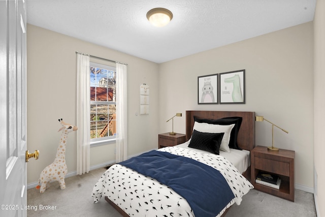 carpeted bedroom with baseboards