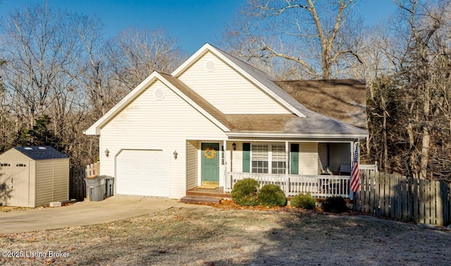 view of front of home with fence, a shed, a porch, driveway, and an attached garage