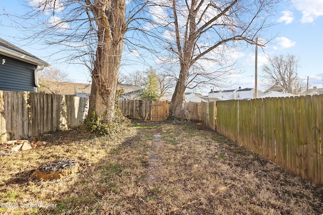 view of yard with a fenced backyard