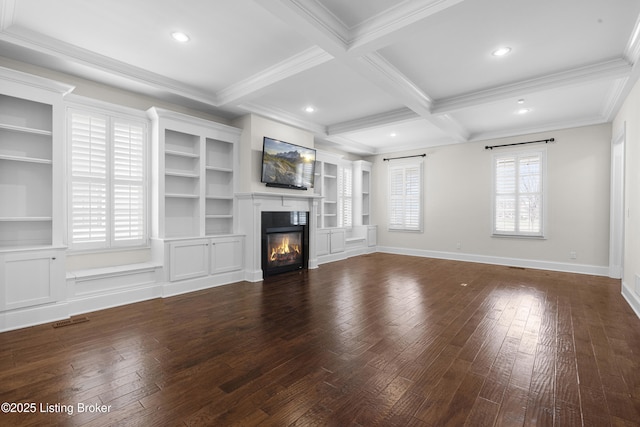 unfurnished living room featuring visible vents, coffered ceiling, beam ceiling, hardwood / wood-style flooring, and a glass covered fireplace