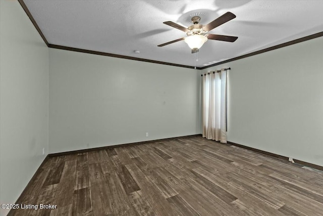 spare room featuring a textured ceiling, crown molding, baseboards, and wood finished floors