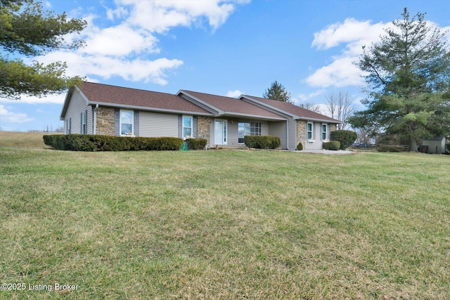 ranch-style house with a front lawn and stone siding