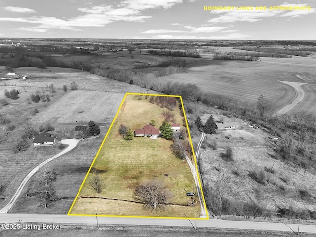 birds eye view of property featuring a rural view