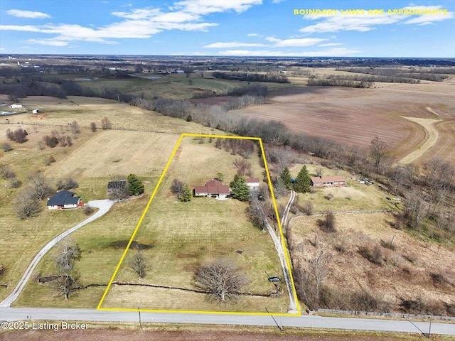 birds eye view of property with a rural view