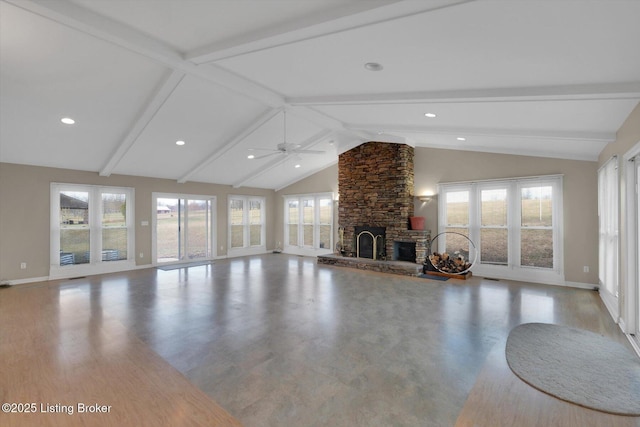 unfurnished living room featuring a stone fireplace, plenty of natural light, and beamed ceiling