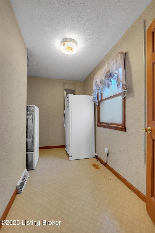 laundry area with visible vents, light floors, washer / clothes dryer, and laundry area