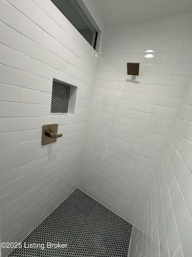 full bathroom with tiled shower