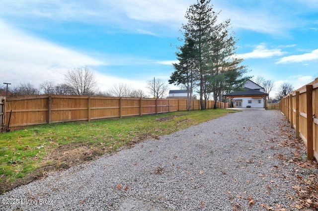 view of road featuring gravel driveway