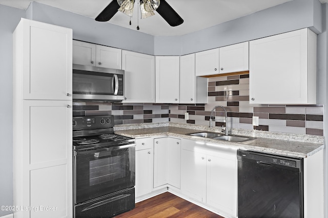 kitchen featuring ceiling fan, black appliances, backsplash, and a sink