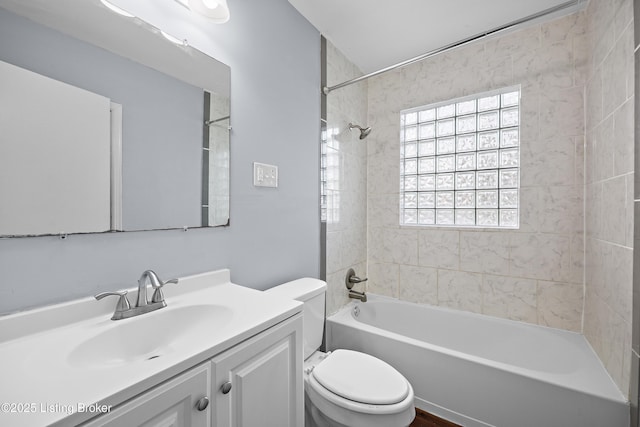 full bathroom featuring toilet, vanity, and shower / bathtub combination