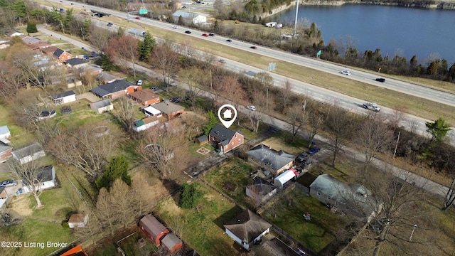 drone / aerial view with a water view and a residential view