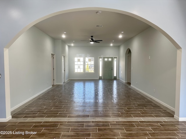 interior space featuring recessed lighting, a ceiling fan, baseboards, and wood tiled floor