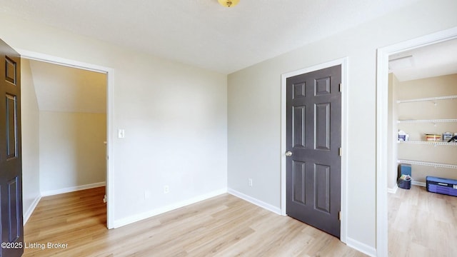 empty room with wood finished floors and baseboards