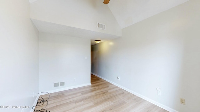 spare room with light wood-type flooring, baseboards, visible vents, and ceiling fan