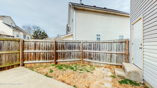 view of yard with a patio and fence