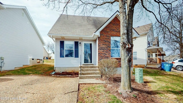 view of front of house featuring brick siding