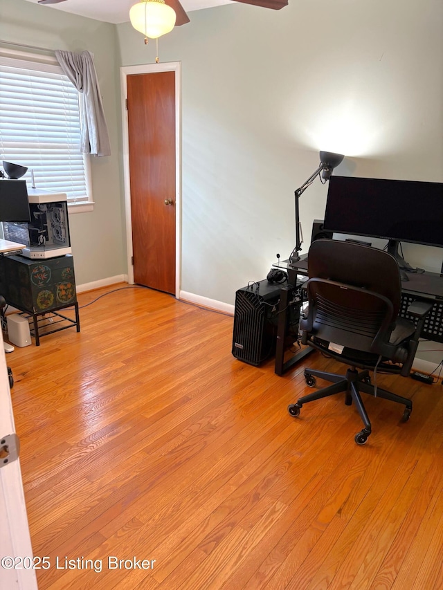 home office with ceiling fan, baseboards, and wood finished floors