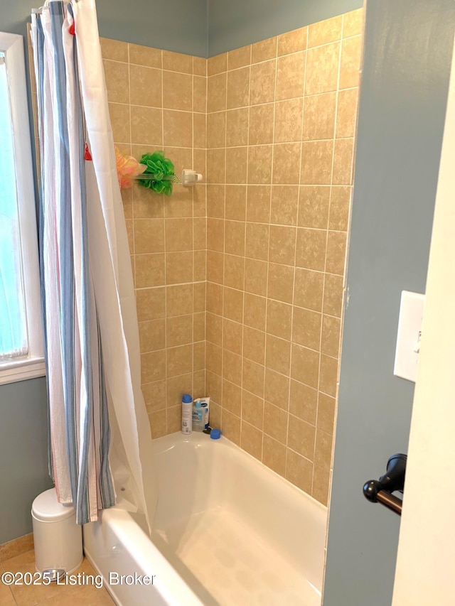 full bathroom featuring shower / bath combo with shower curtain and toilet