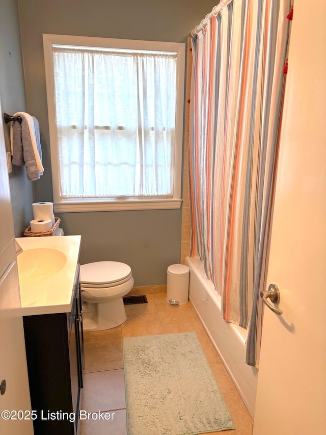 bathroom with visible vents, toilet, shower / bath combo, tile patterned floors, and vanity