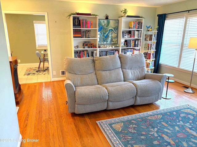 living room with a wealth of natural light and wood finished floors