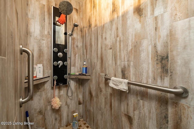 interior details with a tile shower