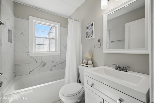 bathroom featuring vanity, toilet, and shower / tub combo with curtain