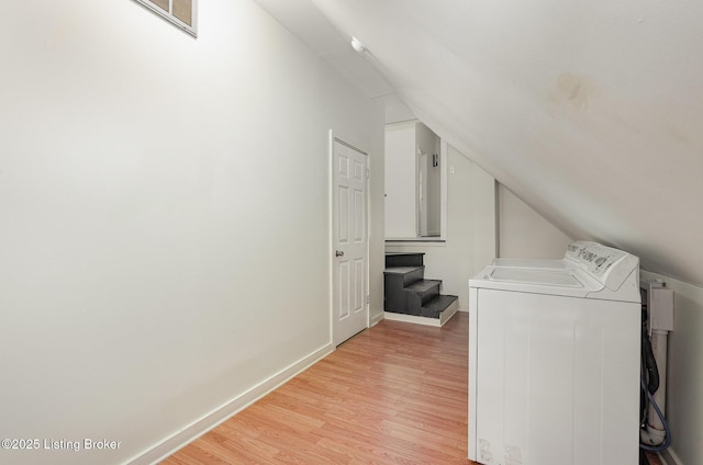 laundry room with laundry area, light wood-style floors, independent washer and dryer, and baseboards