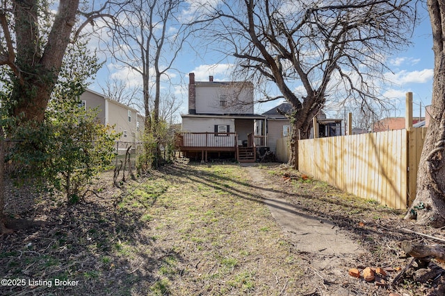 view of yard featuring fence private yard and a wooden deck