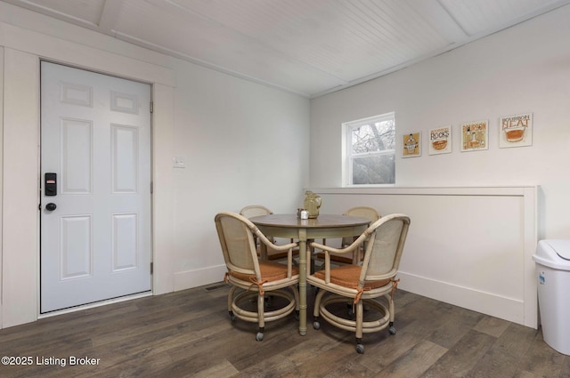 dining room with wood finished floors and baseboards