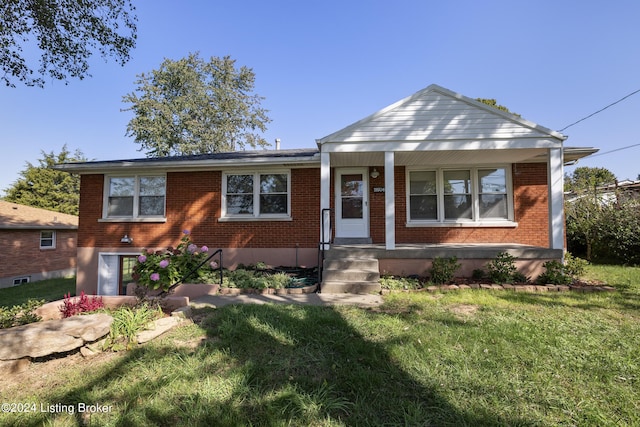 view of front of house featuring brick siding, a porch, and a front yard