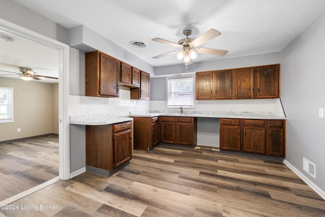 kitchen featuring light countertops, wood finished floors, visible vents, and ceiling fan