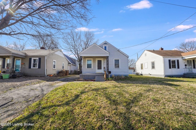 bungalow-style house with a front lawn