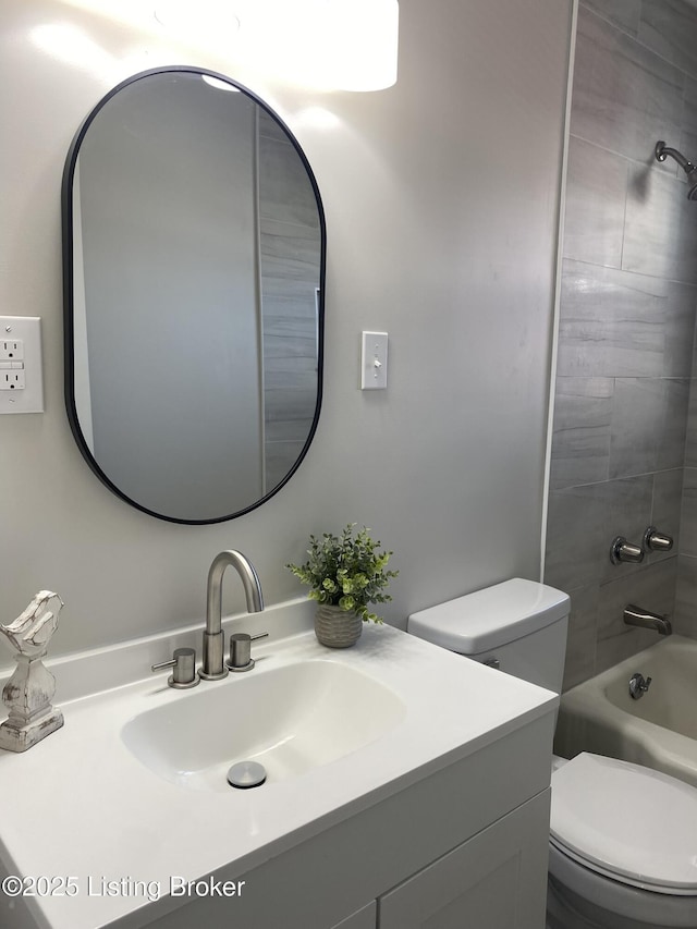 full bath featuring toilet,  shower combination, and vanity