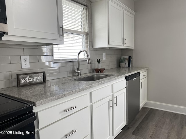 kitchen with a sink, dark wood-style floors, white cabinets, baseboards, and dishwasher